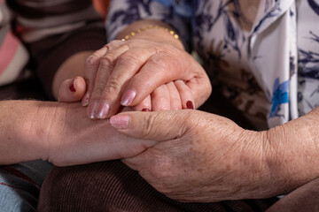 Hands that speak of love, mother and daughter united