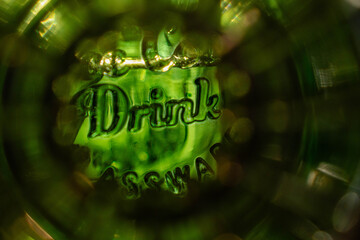 Green glass with the word 