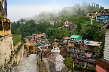 Darjeeling,West Bengal,India -11.08.2023 : Beautiful top view of local houses of Ghum town. Houses are built on mountain slopes. Darjeeling is called queen of hills. Famous hill station.