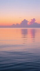 Calm Ocean at Sunset with Pastel Sky Reflection