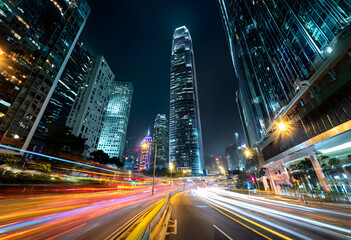 Fototapeta premium Vibrant city street at night with illuminated skyscrapers and moving traffic