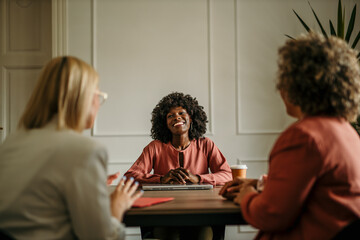 Smiling businesswoman leading a meeting with her colleagues in the office