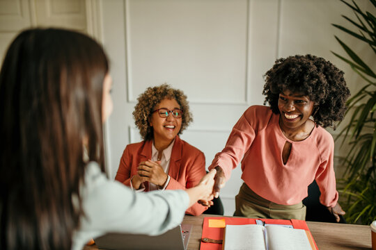 Businesswomen shaking hands after successful job interview