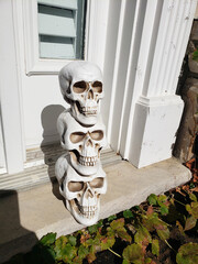 Traditional Halloween doorstep decorations for Americans. Skeletons and skulls at the door.