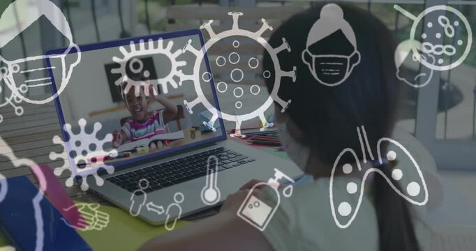 Local student watching peer raising hand for online education jotting notes, health icons floating