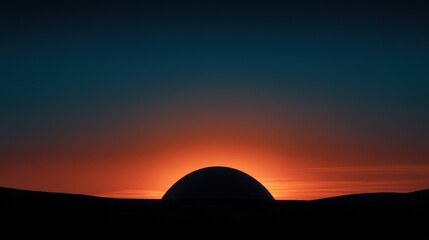 Fototapeta premium Dramatic Sunset Silhouette of a Dome Structure against Vibrant Orange Sky