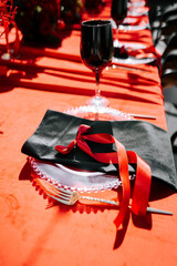Elegant dining setup with red accents for a special occasion or celebration
