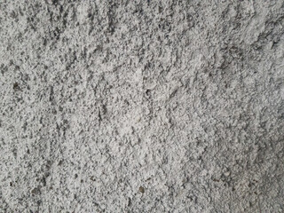 Rough white wall texture with uneven cement surface. Ideal for background, grunge design, construction, or material texture reference.