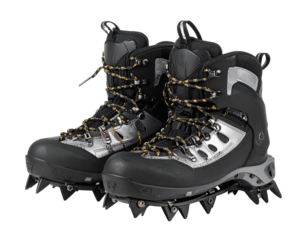 A pair of metal crampons with straps, angled view, essential traction gear for ice climbing and mountaineering, isolated on white.
