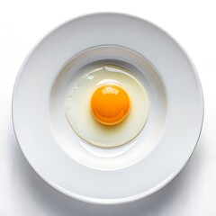 Overhead view of a single fried egg served on a white plate with white solid backround