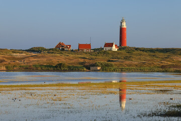 In the Centre, Texel in the Netherlands, Lighthouse, lake, reflection of the lighthouse in the lake, nature reserve