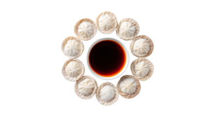 Dumplings arranged in a circular pattern with a soy sauce dip in the center, on a white isolated background.