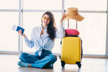 Passenger Woman at the Airport with Suitcase and Travel Essentials Preparing for Exciting...