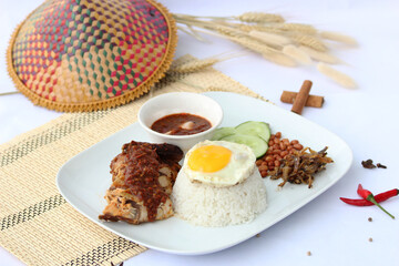 coconut rice with spicy chilli paste served with chicken or nasi lemak ayam sambal