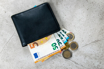 Leather partmone with money, euro coins and bills. Business concept.