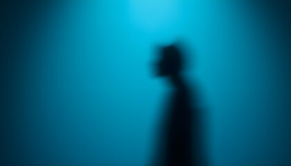 Silhouette of a person walking abstract blue background artistic photography mysterious mood