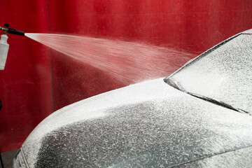 Car Foaming Stage. High-pressure snow foam application ensures deep cleaning and softens grime on...