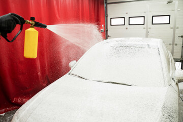 Car Foaming Stage. High-pressure snow foam application ensures deep cleaning and softens grime on...