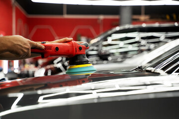 Car paint correction and polishing. Polishing machine expertly removes paint swirls and oxidation...