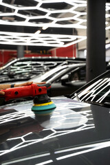Car paint correction and polishing. Polishing machine expertly removes paint swirls and oxidation...