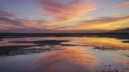 Fototapeta premium Sunset reflecting on tidal flats