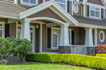 Entrance of painted luxury house in spring with stair steps and nice landscape in Vancouver,...