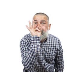 Mature man making a silence gesture, pressing his index finger to his lips