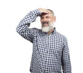 Senior man with beard and checkered shirt suffering from headache, showing frustration and regret...