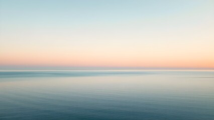 Obraz premium Minimalist Aerial View of Serene Ocean and Colorful Sky Gradient during Twilight, Peaceful Nature Scene with Distant Horizon 