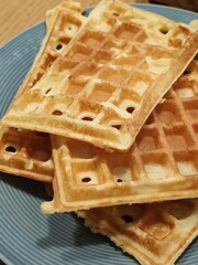 Stack of Golden Belgian Waffles on a Blue Plate
