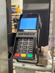 Payment terminal at store, cash terminal, POS system.