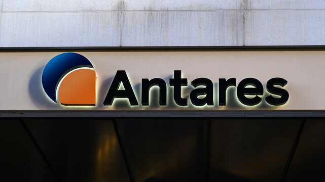 London, UK - April 1, 2025; Sign for Antares a QIC Company with logo on facade of building