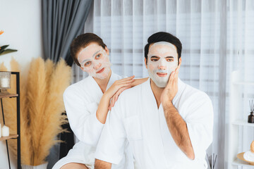 Serene modern daylight ambiance of spa salon, couple customer indulges in rejuvenating with facial...