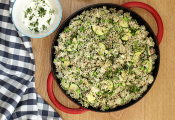 Pilaf with pork. Traditional oriental hot dish of boiled rice, pork, vegetables and spices.