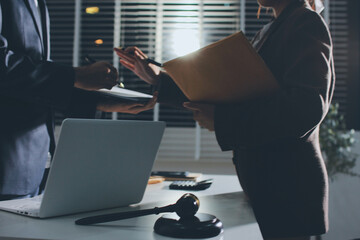 Lawyer explained to the client about the law that must be brought against the court case.