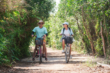 Family Vacation Cycling Activity in Forest Park With Father, Mother and Daughter Enjoying Outdoor Nature Trail Together