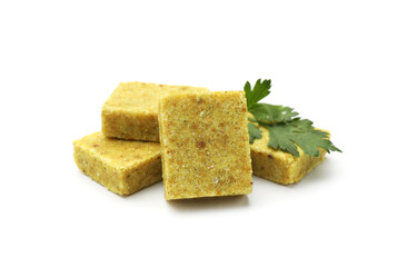 Aromatic bouillon cubes and parsley isolated on white