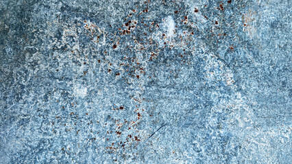 Textured blue surface with intricate patterns of rust and wear, showcasing a weathered appearance,...