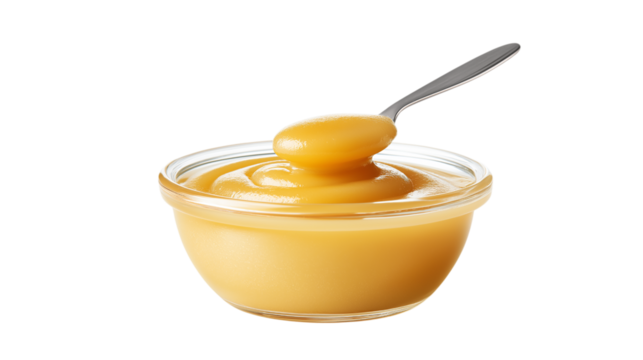 Spoonful of Pear Sauce over a Bowl of Fruit Dessert
