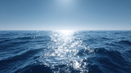 Expansive ocean view with shimmering waves reflecting sunlight, creating a tranquil atmosphere and inviting serenity in the vast blue waters