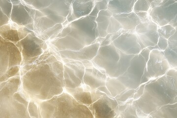 Clear water surface with shimmering reflections and sandy bottom, creating a tranquil and inviting atmosphere for relaxation and leisure activities