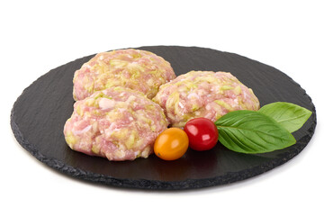 Raw Chicken Meatballs with Tomato and Basil, isolated on white background