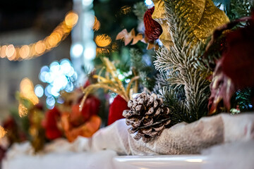 Christmas motif in the evening light, where there is a pine cone and some other accessories there...