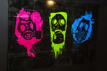 Various gas masks painted on the wall	
