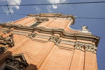 Part of a building with red painted walls in Italy