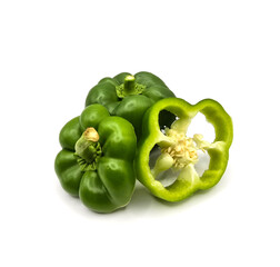 Fresh cut capsicum or, green bell peppers on white background. Whole and cut green bell peppers on...