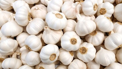 Pile of fresh organic garlic bulbs at a local farmers market stand