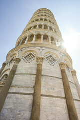 Leaning Tower of Pisa, Italy Photographed at an angle against a blue sky.