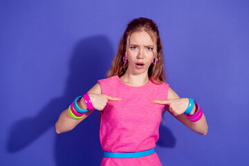 Youthful woman in vibrant pink outfit gesturing dramatically on a colorful background, expressing...
