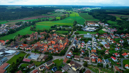 Aerial panoramic view around the old town of the city Lichtenau on a cloudy spring noon in Germany.